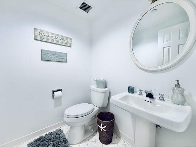 bathroom featuring tile patterned floors, toilet, and sink