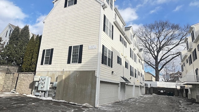 view of side of property with a garage