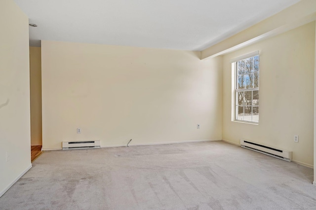 empty room with a baseboard radiator and light colored carpet