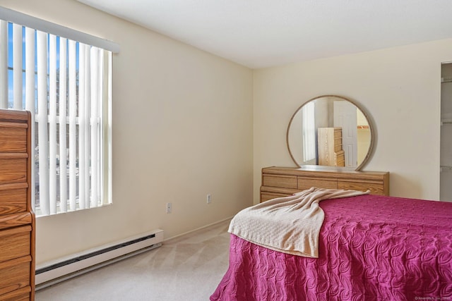 carpeted bedroom with a baseboard radiator