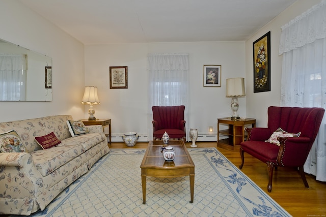 living room featuring hardwood / wood-style flooring and a baseboard radiator