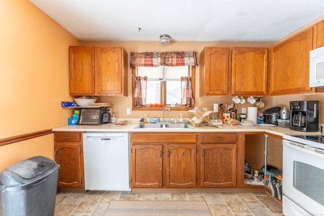 kitchen with sink and white appliances