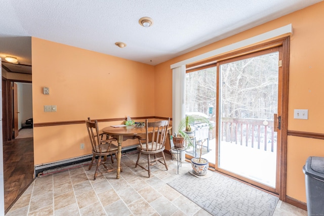 dining space featuring a textured ceiling