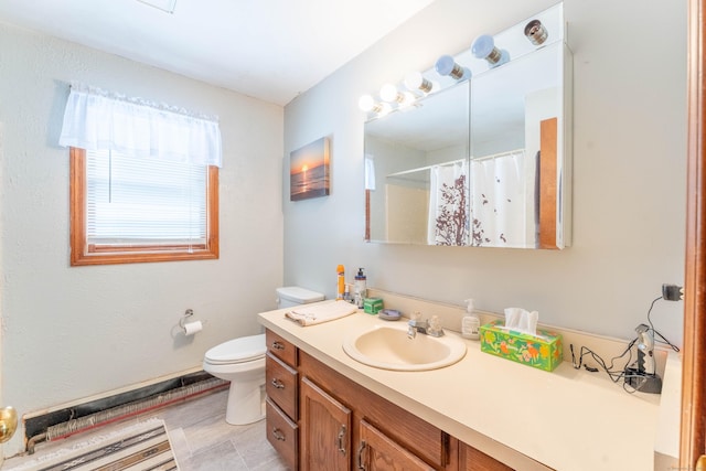 bathroom with vanity, walk in shower, and toilet