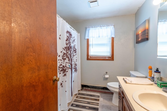 bathroom featuring vanity and toilet