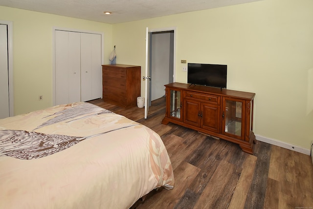 bedroom featuring dark hardwood / wood-style flooring