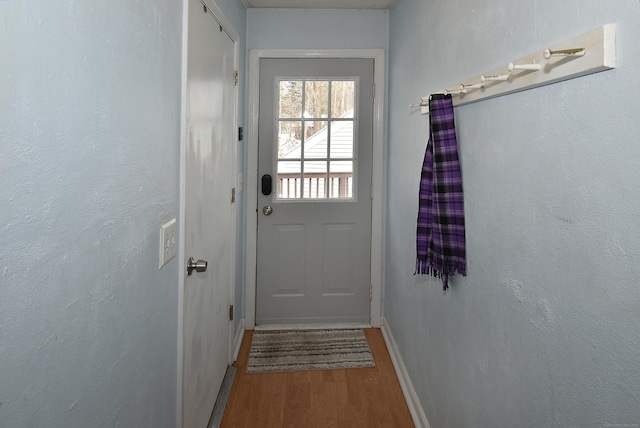 doorway with wood-type flooring