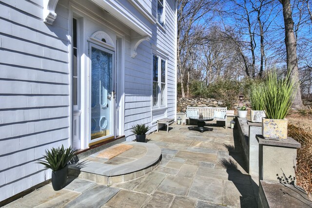 view of patio / terrace with entry steps and an outdoor hangout area