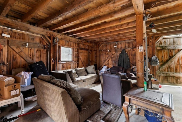 interior space featuring wood ceiling, wooden walls, and beam ceiling