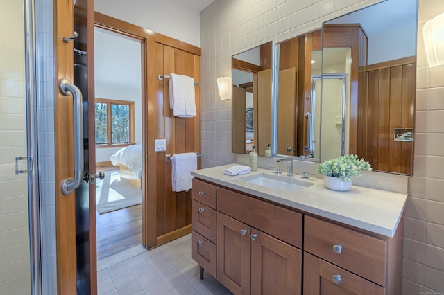 bathroom with vanity, tile patterned floors, and walk in shower