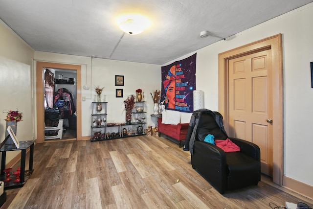 living area with hardwood / wood-style flooring