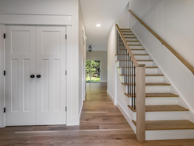 staircase featuring hardwood / wood-style floors