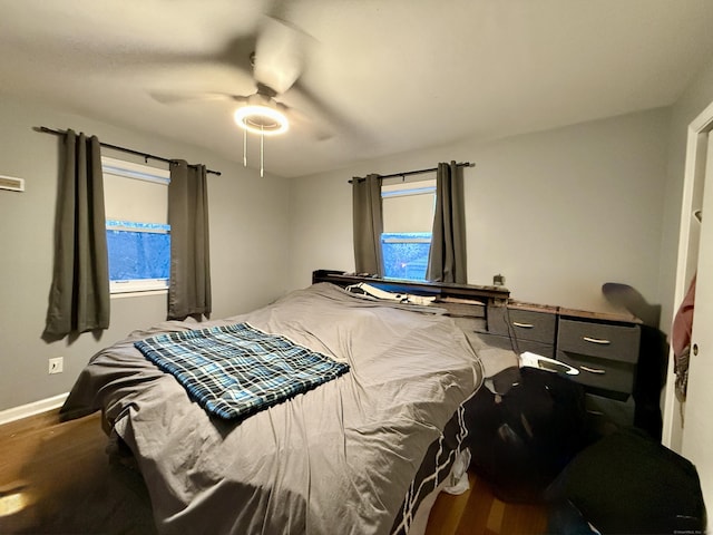 bedroom featuring ceiling fan and wood-type flooring