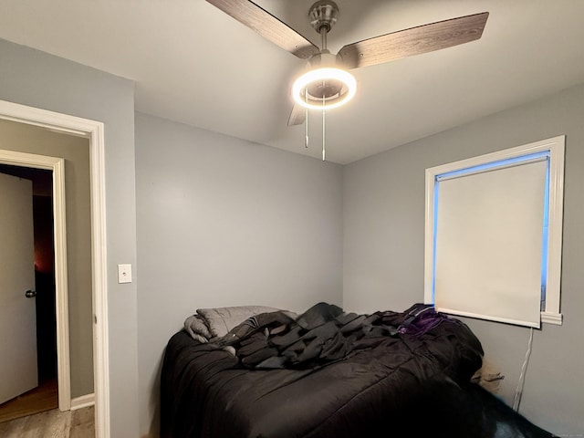 bedroom featuring ceiling fan and light hardwood / wood-style flooring