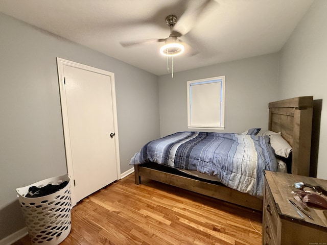 bedroom featuring ceiling fan and light hardwood / wood-style flooring