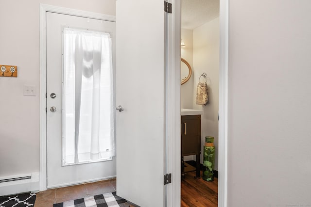 tiled entrance foyer with baseboard heating