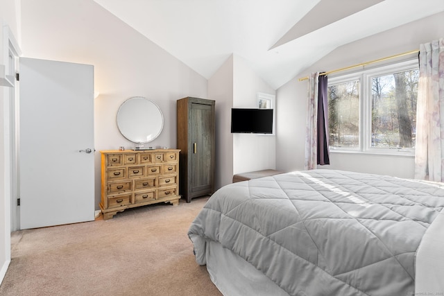 carpeted bedroom with vaulted ceiling