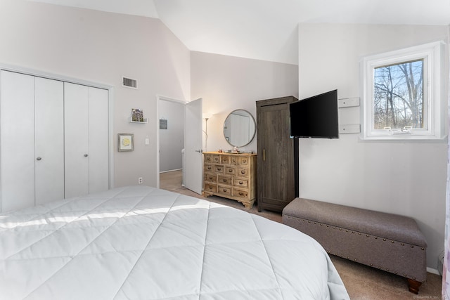 bedroom featuring high vaulted ceiling