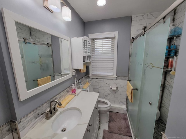 bathroom with vanity, a shower with shower door, and toilet