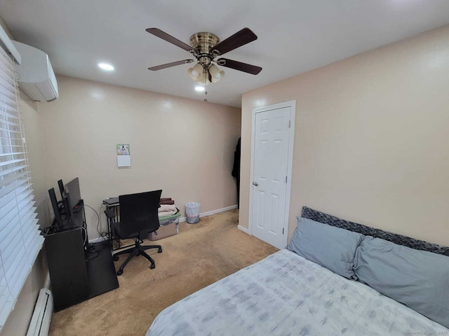 bedroom with light carpet, a baseboard heating unit, a wall unit AC, and ceiling fan