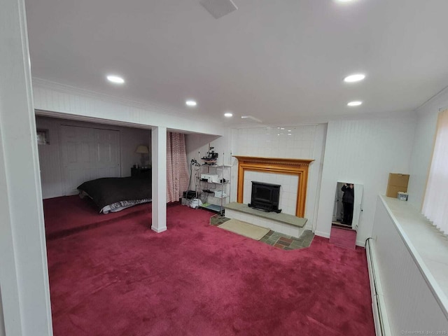 basement featuring ornamental molding and carpet flooring