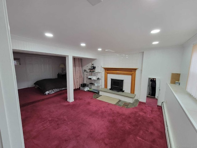 basement featuring ornamental molding and carpet