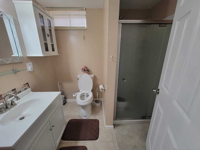 bathroom featuring vanity, toilet, tile patterned floors, and walk in shower