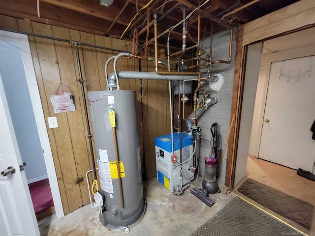 utility room with gas water heater