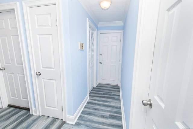 hall featuring crown molding and hardwood / wood-style floors