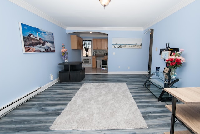 living area featuring heating unit, crown molding, dark wood-type flooring, and a baseboard radiator