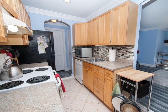 kitchen featuring sink, crown molding, tasteful backsplash, white appliances, and exhaust hood