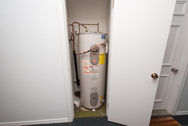 utility room featuring water heater