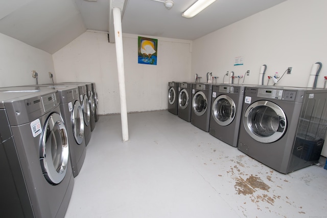 clothes washing area with washer and clothes dryer