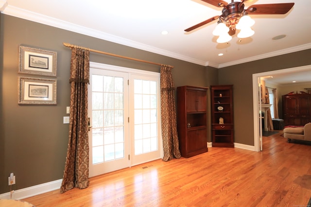 interior space with crown molding, ceiling fan, light hardwood / wood-style flooring, and a wealth of natural light