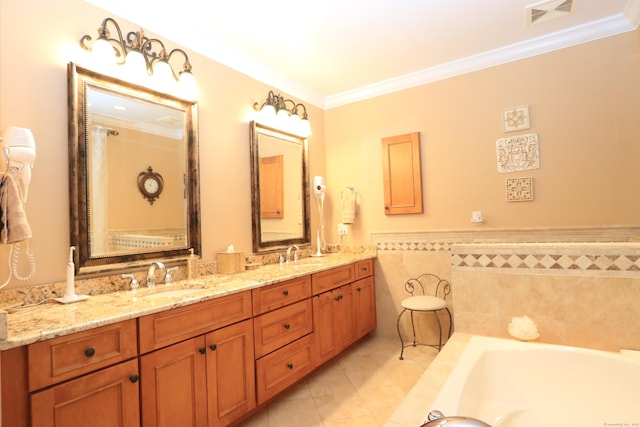 bathroom featuring tile patterned flooring, ornamental molding, a tub, and vanity