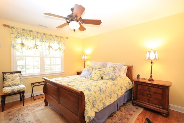 bedroom featuring hardwood / wood-style floors and ceiling fan