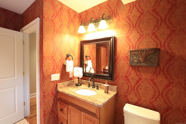 bathroom with vanity and toilet