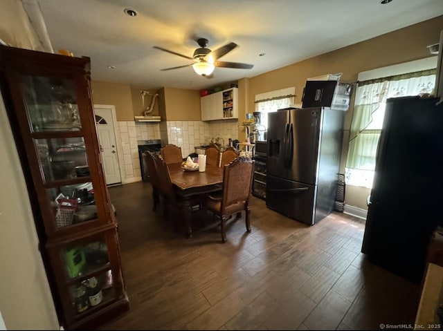 dining area featuring dark hardwood / wood-style floors and ceiling fan