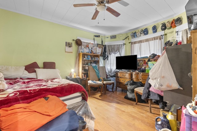 bedroom featuring hardwood / wood-style floors and ceiling fan