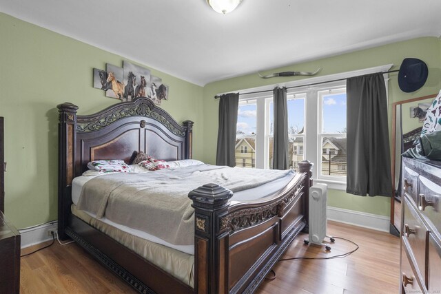 bedroom with wood-type flooring