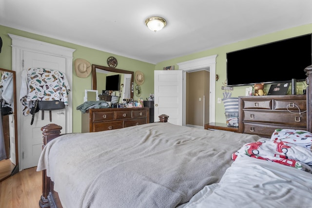 bedroom with hardwood / wood-style floors