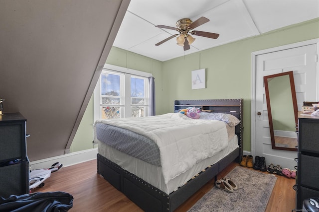 bedroom with dark wood-type flooring and ceiling fan