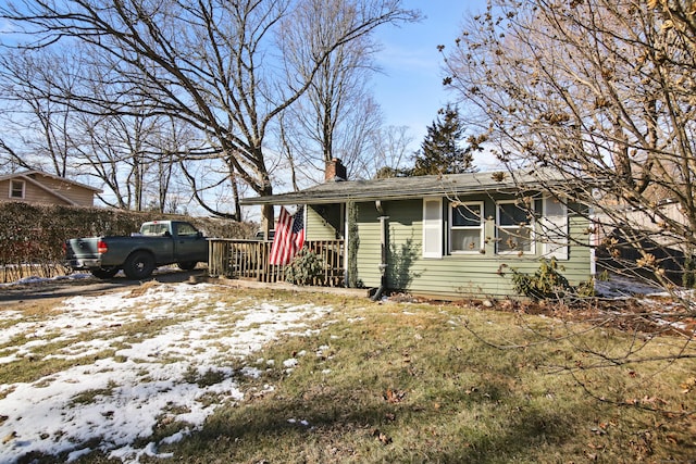 view of front of home with a yard