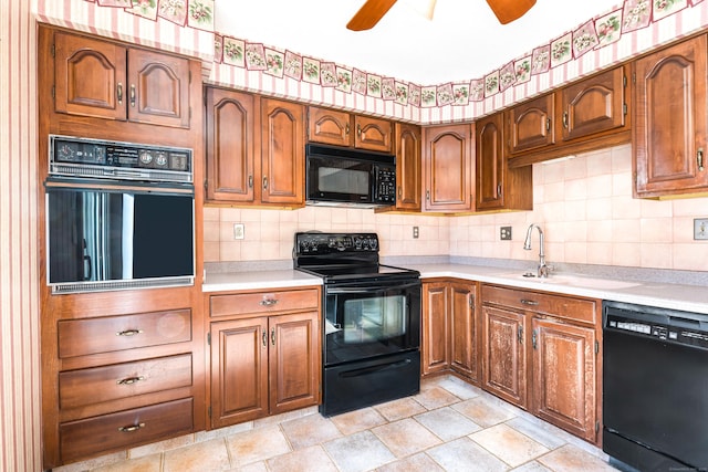 kitchen with sink, decorative backsplash, ceiling fan, and black appliances