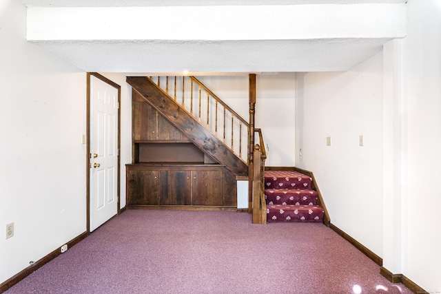 basement with carpet flooring