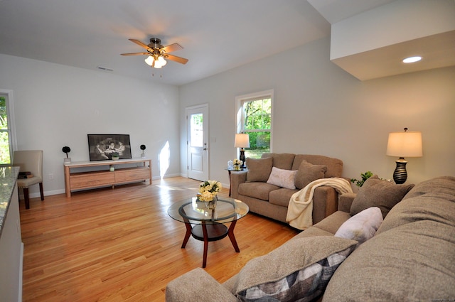 living room featuring ceiling fan and light wood-type flooring