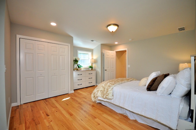 bedroom featuring a closet and light wood-type flooring