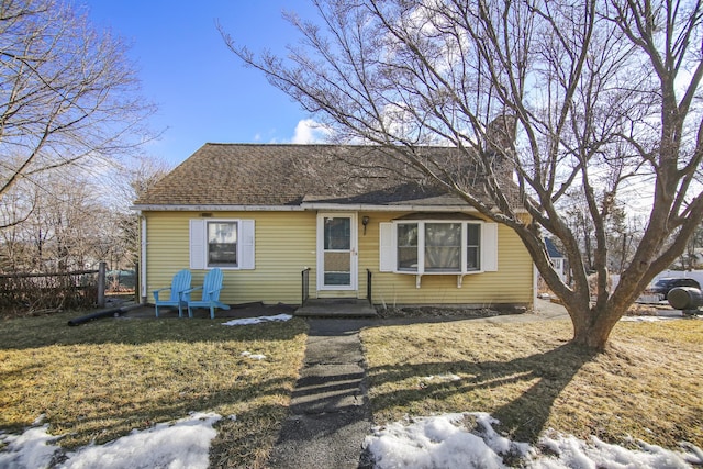 bungalow-style home featuring a yard