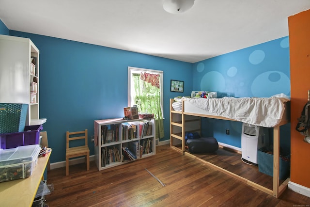 bedroom with dark wood-type flooring