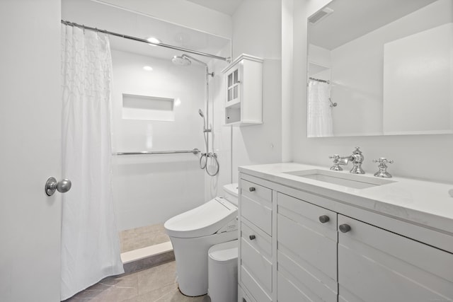 bathroom with vanity, a shower with curtain, tile patterned floors, and toilet